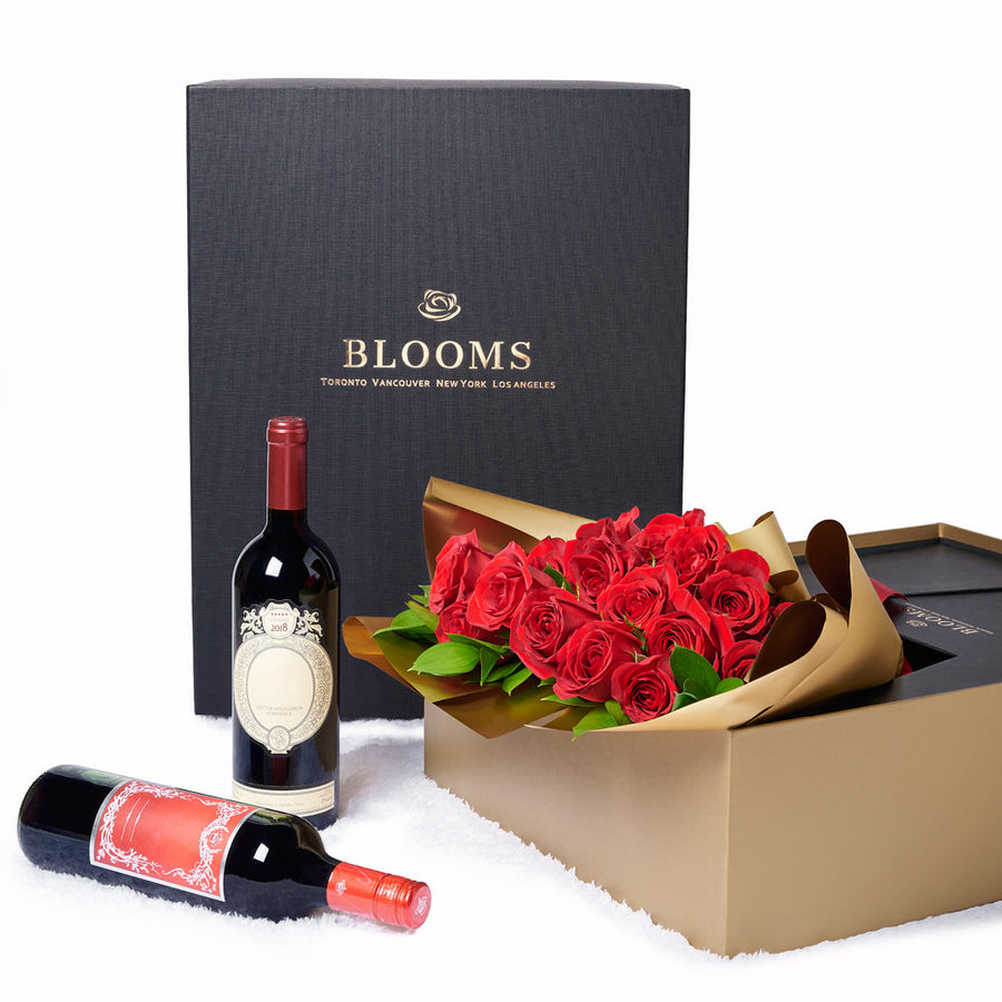 Valentine's Day 18 Stem Red Roses With Chocolate & Wine, 18 red roses gathered together with Salal and Baby’s Breath in a floral wrap and tied with designer ribbon inside a sleek black designer box with chocolate truffles and two bottles of wine, Holiday gifts from Canada Blooms - Canada Delivery