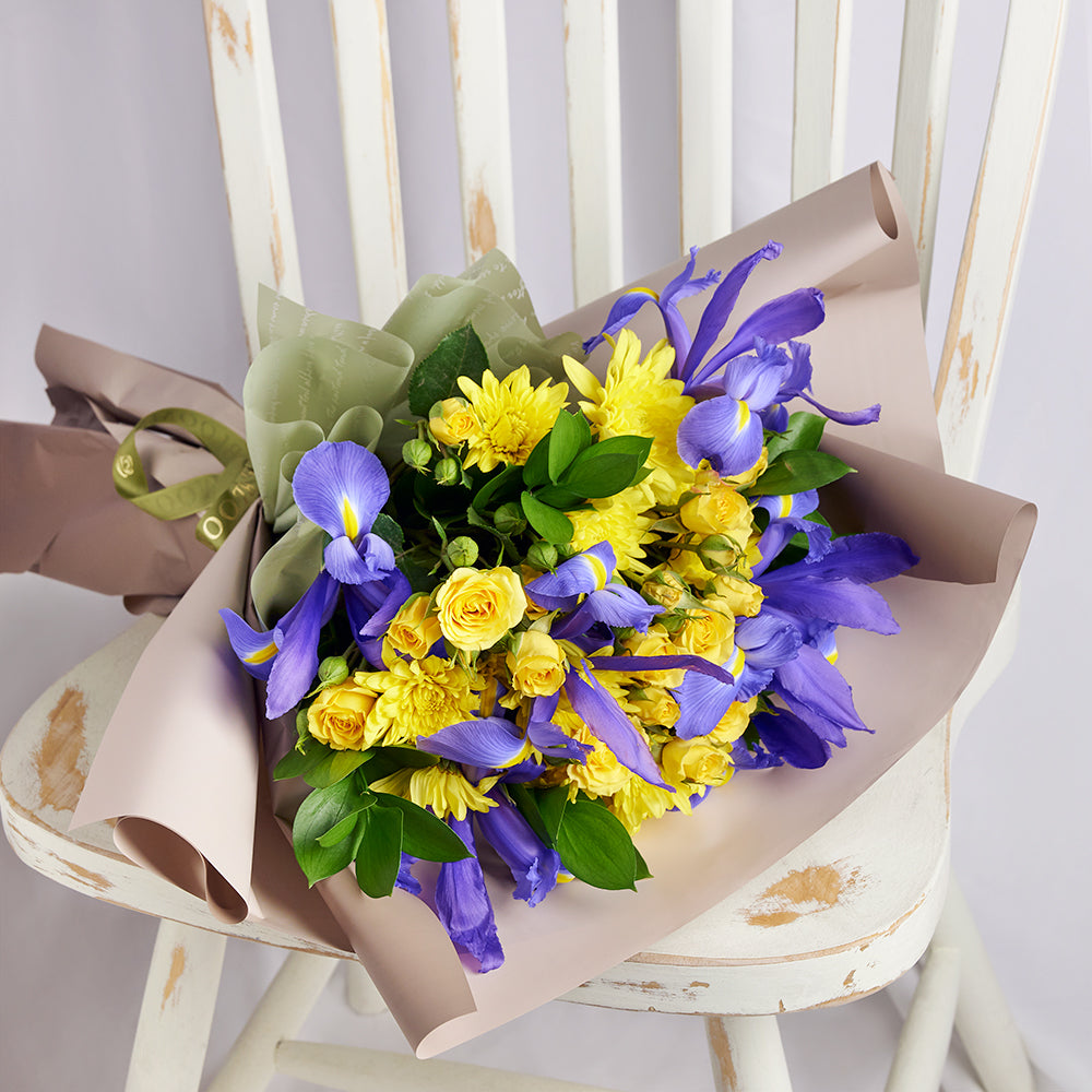 Luminous Lavender Iris Bouquet, purple irises and yellow spray roses, daisies, and greens gathered in a floral wrap and tied with a designer ribbon, Flower Gifts from Canada Blooms - Canada Delivery