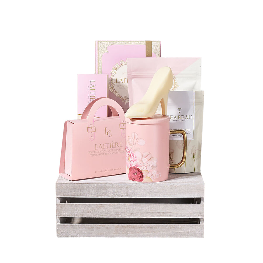 Perfect Pink Chocolate & Tea Crate, box of chocolate bars, assorted macarons, white chocolate chip pink velvet cookies, white chocolate high heels, vanilla chai, and an adorable pink floral mug—all thoughtfully packed in a wooden crate, Gift Sets from Blooms Canada - Same Day Canada Delivery.