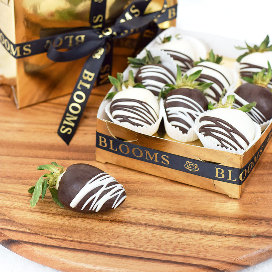 Berry Drizzle Chocolate Dipped Strawberries, 9 strawberries covered in dark chocolate and milk chocolate and drizzled with white and dark chocolate on top. These strawberries come packed in a stylized gold coloured box for gifting, Fruit Gifts from Blooms Canada - Same Day Canada Delivery.