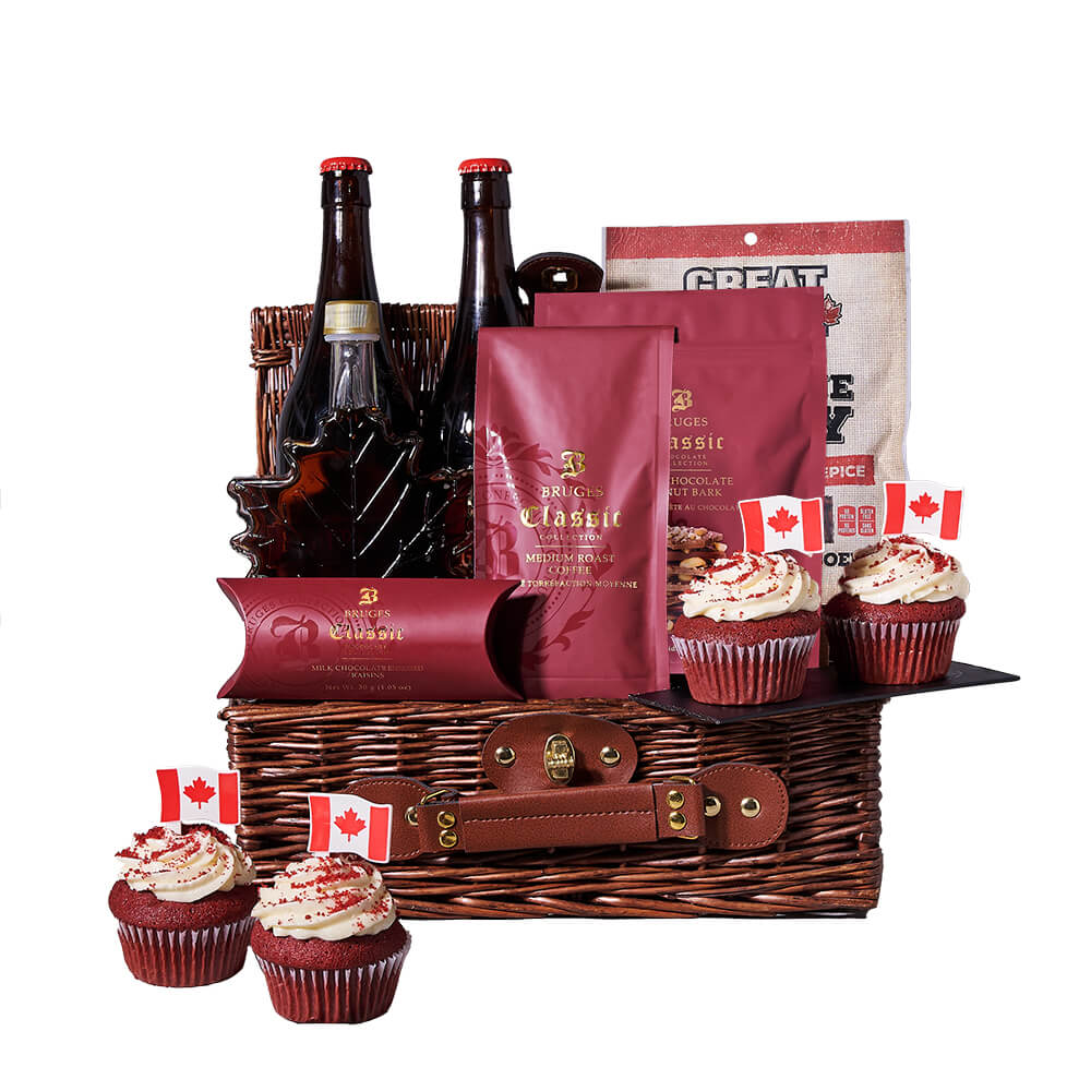 Big Brew Canada Day Gift, two large specialty beers, maple syrup, coffee, milk chocolate raisins, milk chocolate peanut bark, sweet heat beef jerky, four red velvet Canada Day cupcakes, all beautifully arranged in a large wicker basket, Gift Baskets from Canada Blooms - Same Day Canada Delivery.