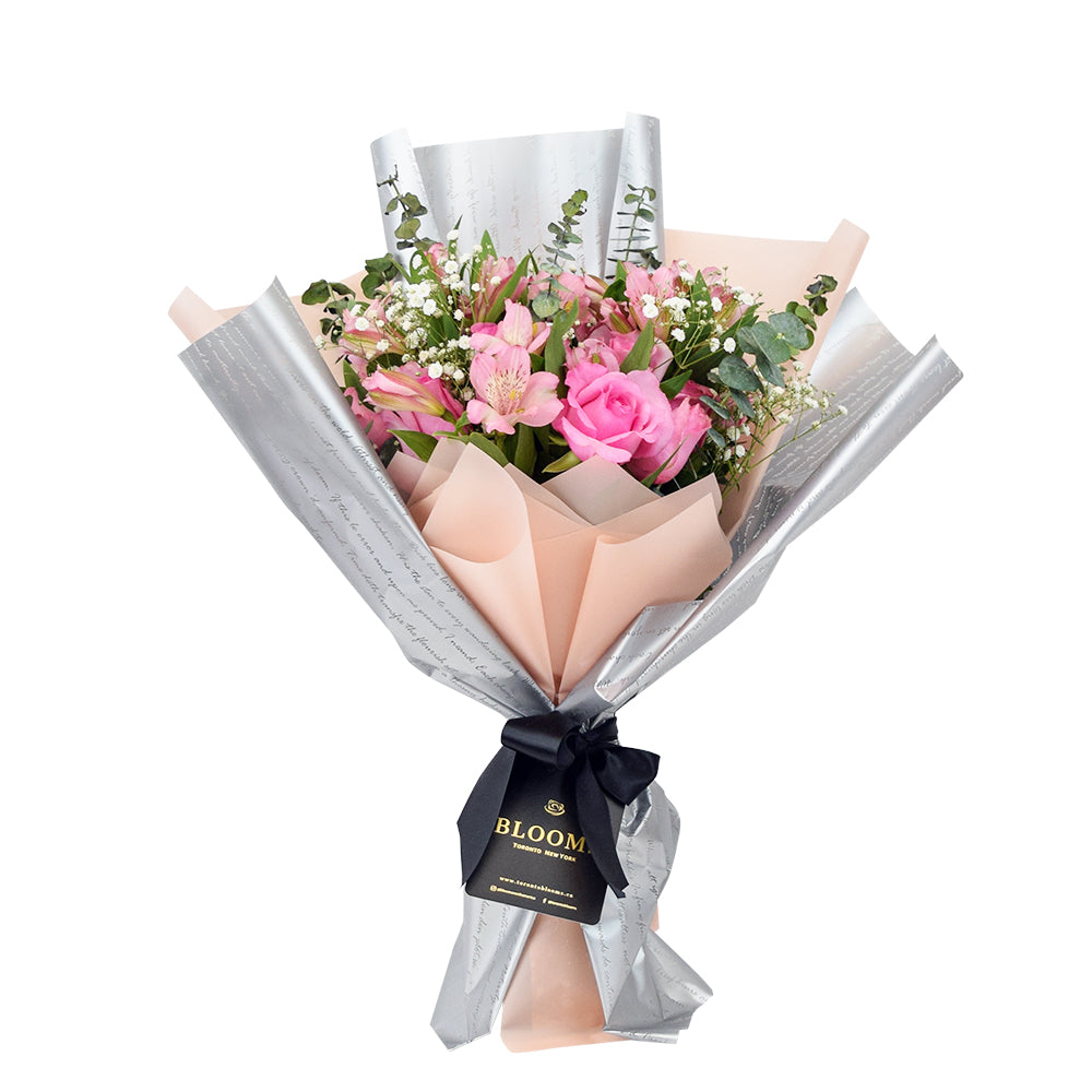 Blushing Notes Mixed Rose Bouquet, selection of pink roses and other filler flowers and leaves beautifully gathered together with designer twine or ribbons in a floral wrap, Flower Gifts from Canada Blooms - Same Day Canada Delivery.