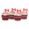 Canada Day Red Velvet Cupcakes, four perfectly baked red velvet cupcakes topped with smooth cream cheese frosting and charming Canadian flag decorations, Baked Goods from Blooms Canada - Same Day Canada Delivery.