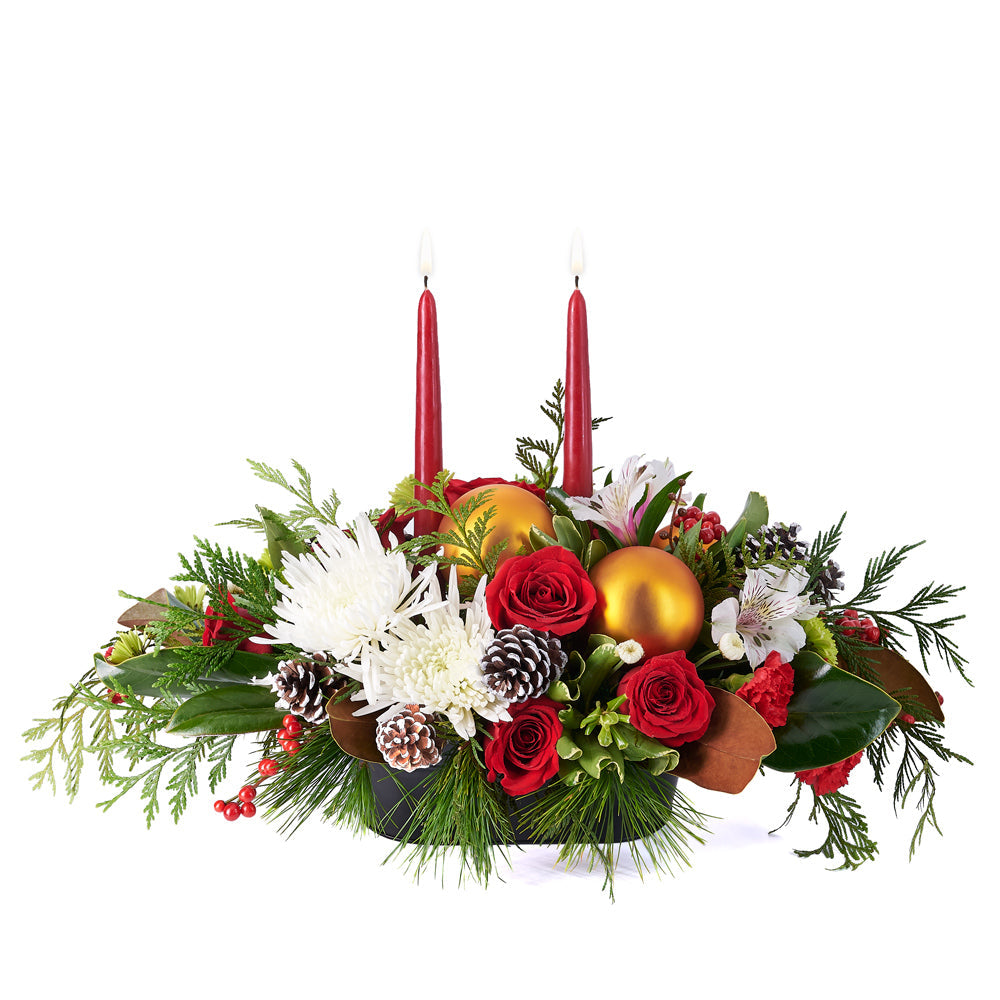 Candlelit Holiday Floral Arrangement, roses, spider chrysanthemums, carnations, chrysanthemums, pine cones, alstroemeria, and greenery in a metal tin container, Flower Gifts from Canada Blooms - Same Day Canada Delivery.