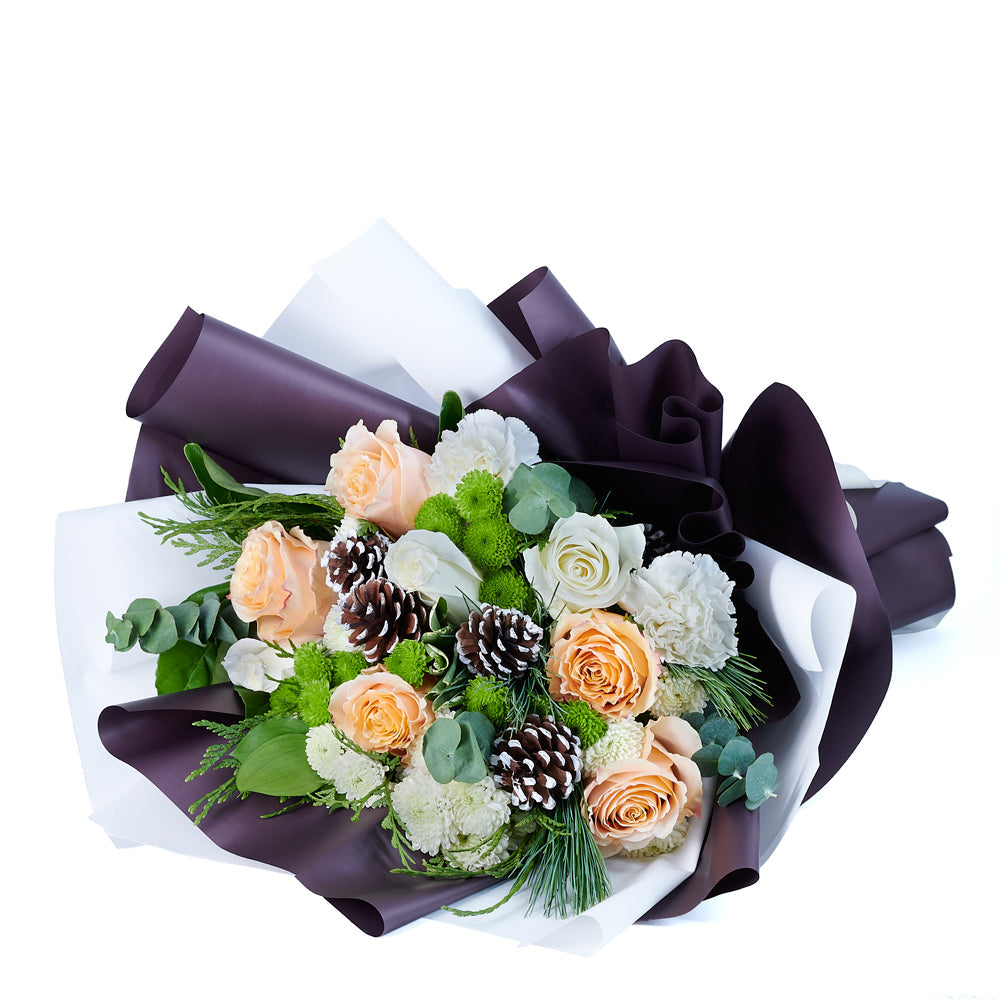 Elegant Winter Mixed Bouquet, roses, chrysanthemums, pine cones, and greens gathered in a floral wrap and tied with designer ribbon, Flower gifts from Canada Blooms - Canada Delivery