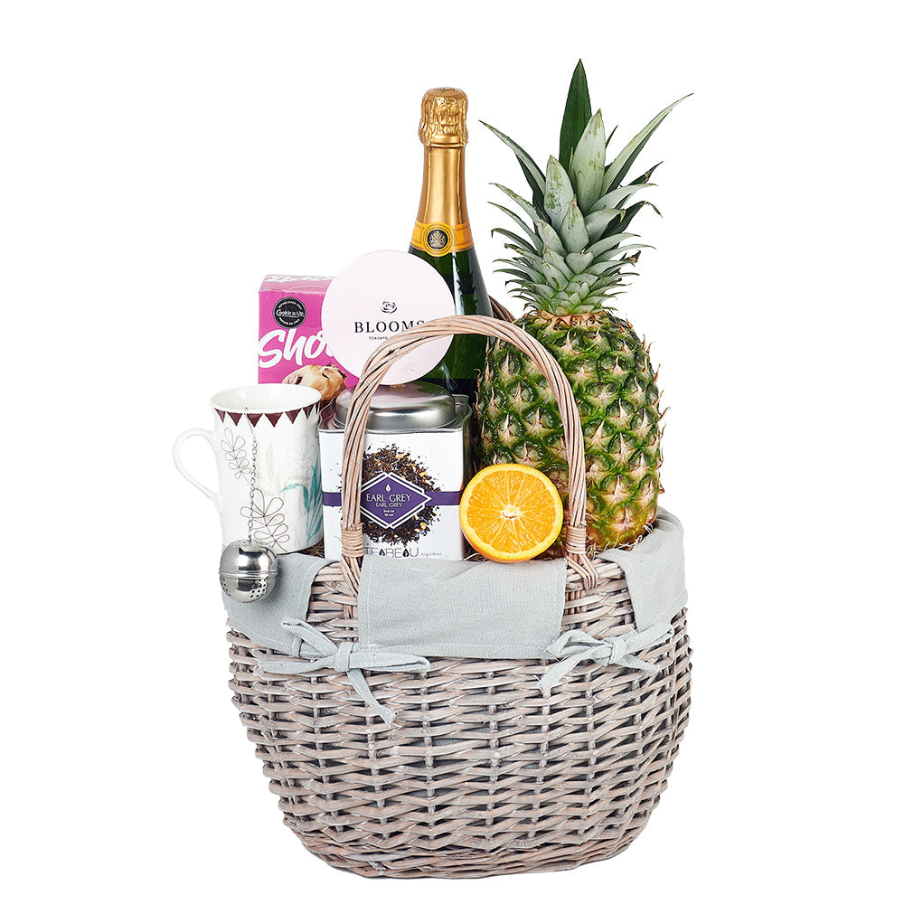 Garden Champagne Shop Basket, farm-fresh fruit, gourmet chocolate truffles, delectable gourmet shortbread cookies, Earl Grey Tea, a bone china tea cup, and fine sparkling wine, Gourmet Gifts from Blooms Canada - Same Day Canada Delivery.