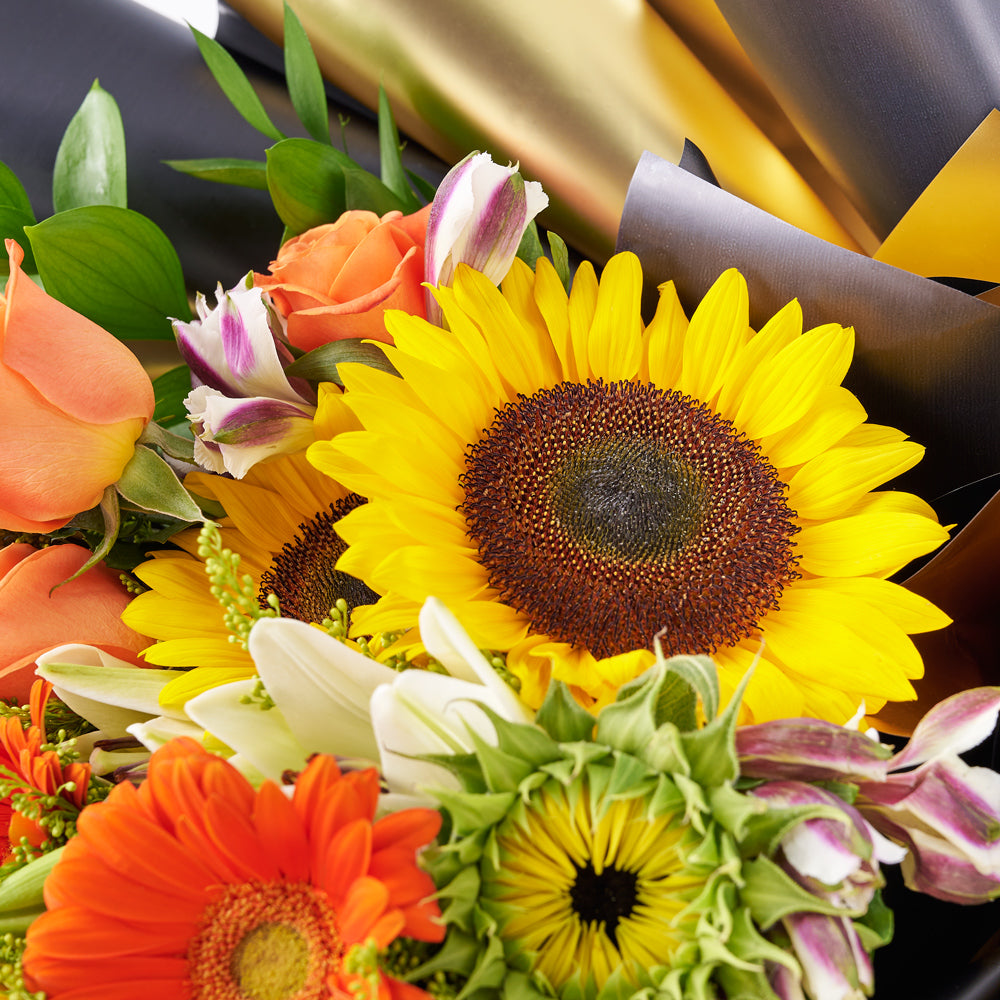 Let Your Light Shine Sunflower Bouquet, range of vibrant hues showcasing sunflowers, lilies, daisies, roses, alstroemeria, and more from Canada Blooms - Canada Delivery