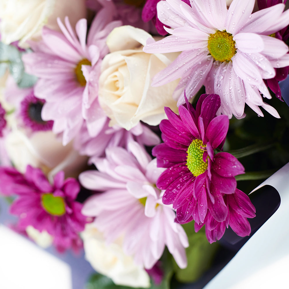 Mixed Lavender Floral Gift Set, pink and purple roses, daisies, eucalyptus, and salal in a floral wrap and tied with designer ribbon, 12 assorted chocolate truffles, Floral Gifts from Canada Blooms - Canada Delivery