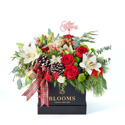‘Tis the Season Holiday Box Arrangement, lilies, roses, hydrangea, spider chrysanthemums, chrysanthemums, hypericum berries, mini carnations, large pine cones, Christmas decorations, ribbons, and greens all gathered into a square black designer box, Holiday gifts from Blooms Canada - Same Day Canada Delivery.