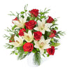 Winter Flower Arrangement, red roses, white lilies, and greenery in a pot, Flower Gifts from Blooms Canada - Same Day Canada Delivery.