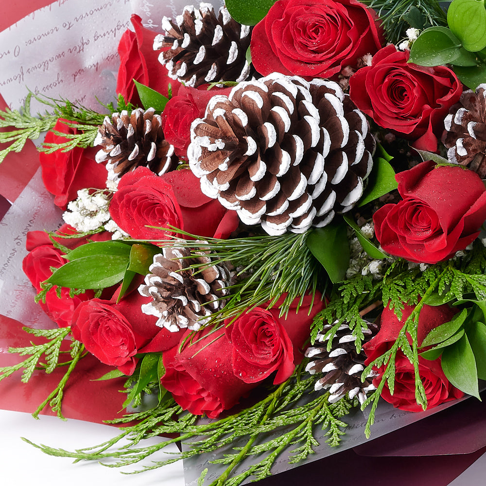 Winter Rose Bouquet, roses, pine cones, baby’s breath, and greens in a floral wrap and tied with a beautiful designer ribbon, Flower Gifts from Canada Blooms - Canada Delivery