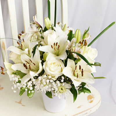 Alabaster Mixed Lily Arrangement, lilies, alstroemeria, roses, daisies, baby’s breath, and greens in a ceramic vessel, Lily Gifts from Blooms Canada - Same Day Canada Delivery.