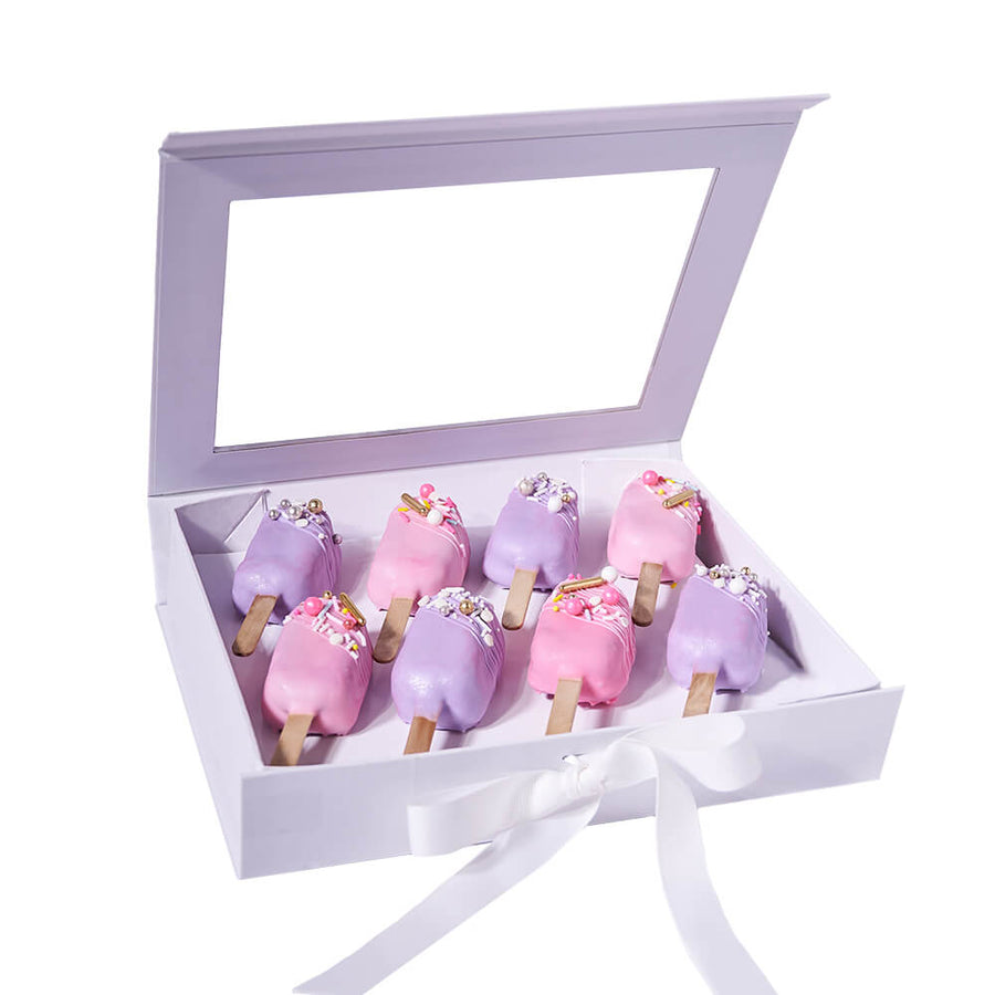 Cakecicle Dessert Gift Box, eight brownie cakecicles adorned with pink and purple icing, beautifully decorated with sprinkles, and elegantly packed in a lovely gift box, Baked Goods from Blooms Canada - Same Day Canada Delivery.