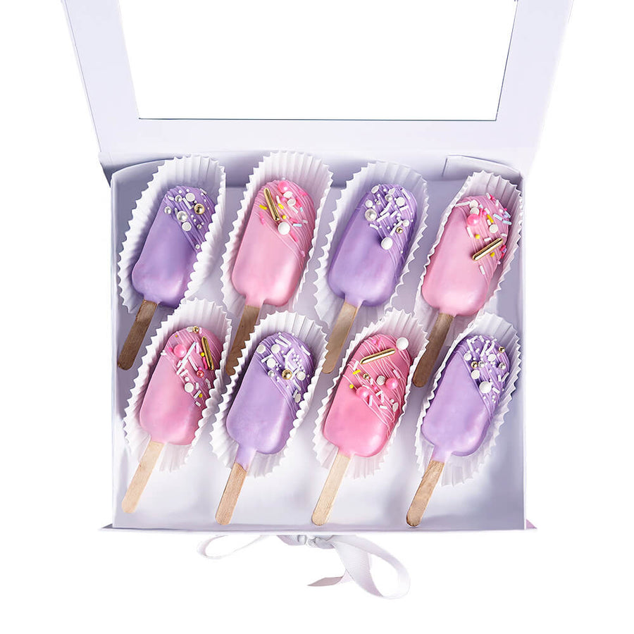 Cakecicle Dessert Gift Box, eight brownie cakecicles adorned with pink and purple icing, beautifully decorated with sprinkles, and elegantly packed in a lovely gift box, Baked Goods from Canada Blooms - Same Day Canada Delivery.