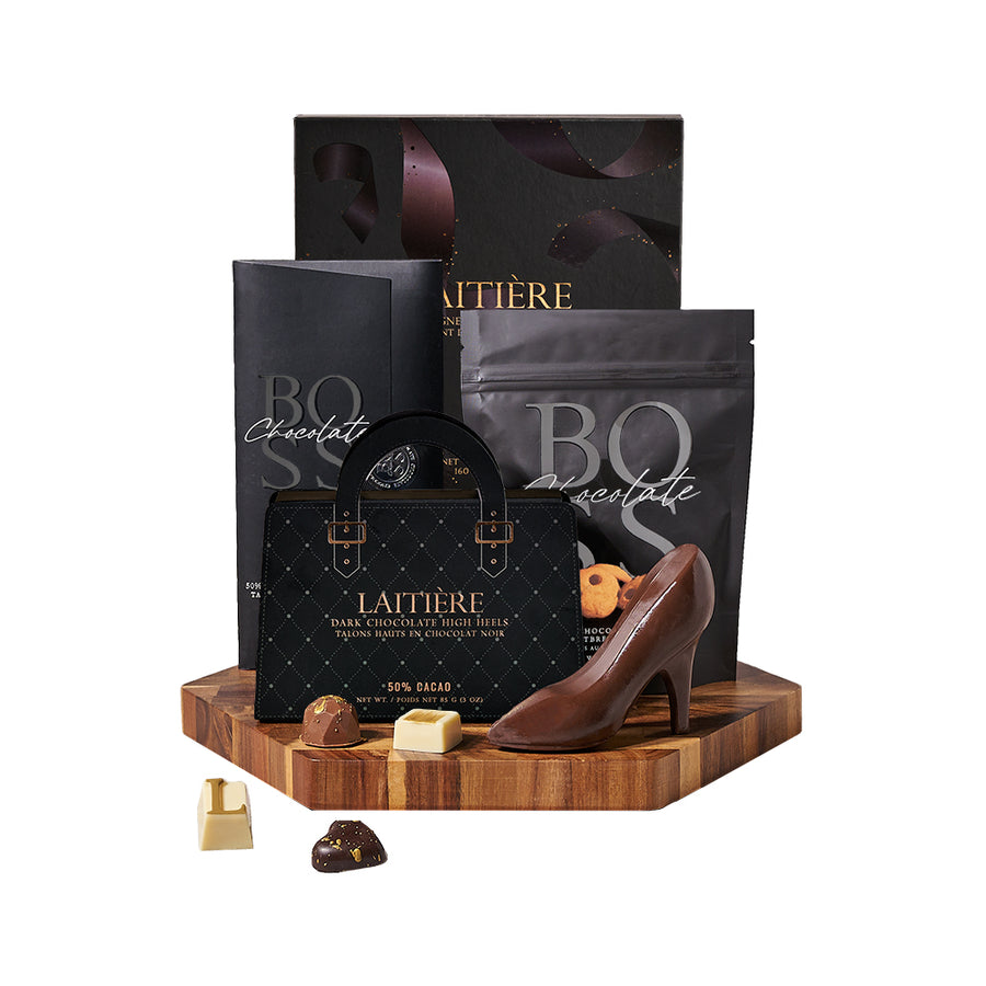 Dark Chocolate Variety Gift Board, bar of dark chocolate, dark chocolate chip mocha shortbread cookies, dark chocolate high heels, champagne-inspired chocolate truffles, and a beautiful hexagonal end-grain cutting board, Gourmet Gifts from Canada Blooms - Canada Delivery
