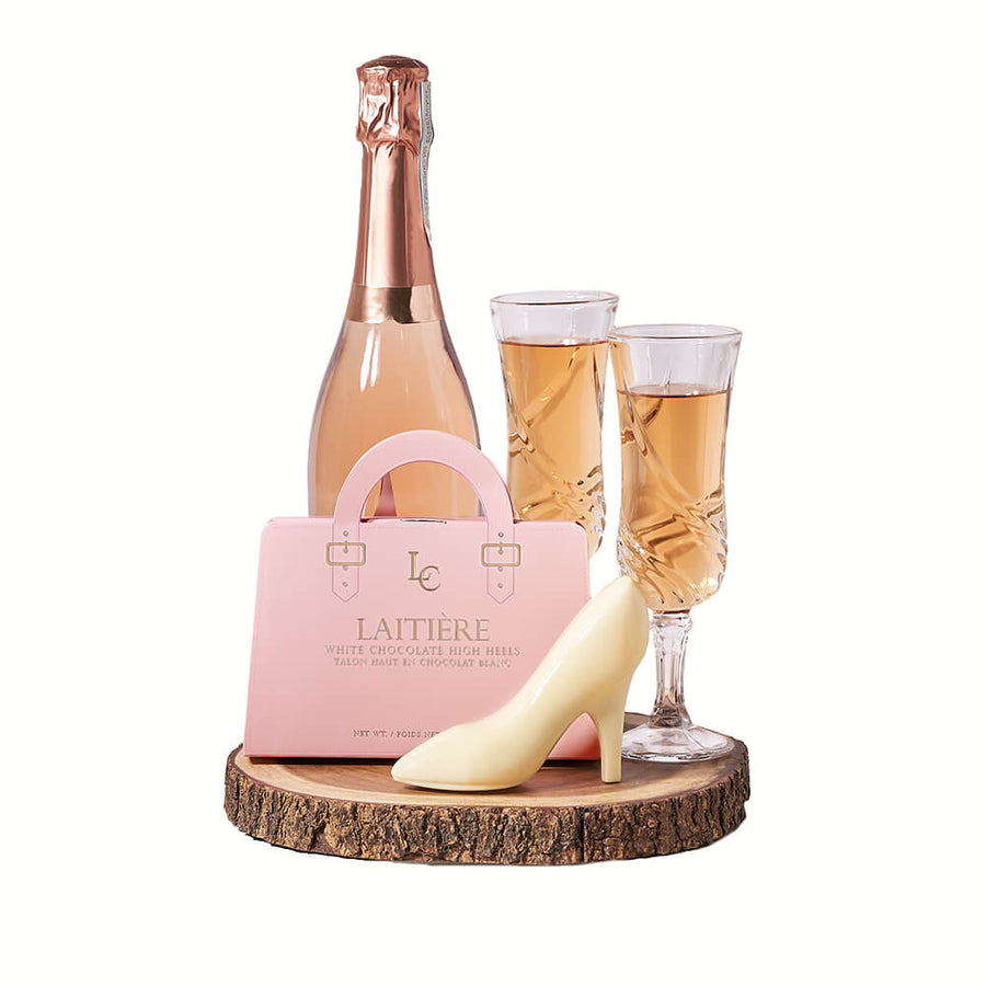 Diva Champagne & Chocolate Gift, bottle of sparkling wine, two champagne flutes, a set of white chocolate high heels, and a live-edge serving board, Champagne Gifts from Blooms Canada - Same Day Canada Delivery.