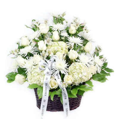 Luminous white mixed flower arrangement in basket. Same Day Blooms Canada Delivery