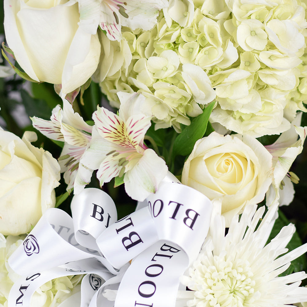 Luminous white mixed flower arrangement in basket – Canada Blooms - Canada Delivery