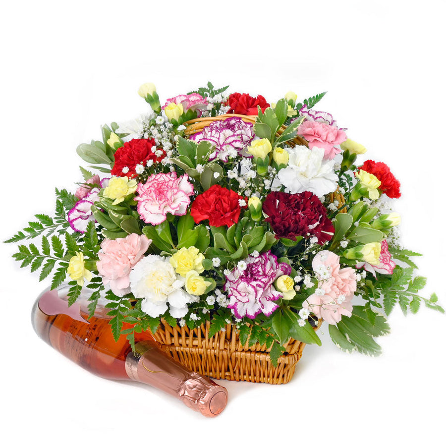 Luxe Delight Flowers Champagne Gift, carnations, baby’s breath, and greens in a classic basket, bottle of champagne, Flower Gifts from Blooms Canada - Same Day Canada Delivery.
