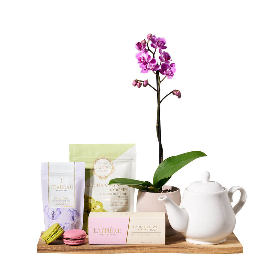 Orchid & Gourmet Tea Gift Set, ceramic teapot, a lovely potted orchid plant, Earl Grey tea, matcha green tea cookies, assorted macarons, and a beautiful acacia wood serving board, Gourmet Gifts from Blooms Canada - Same Day Canada Delivery.