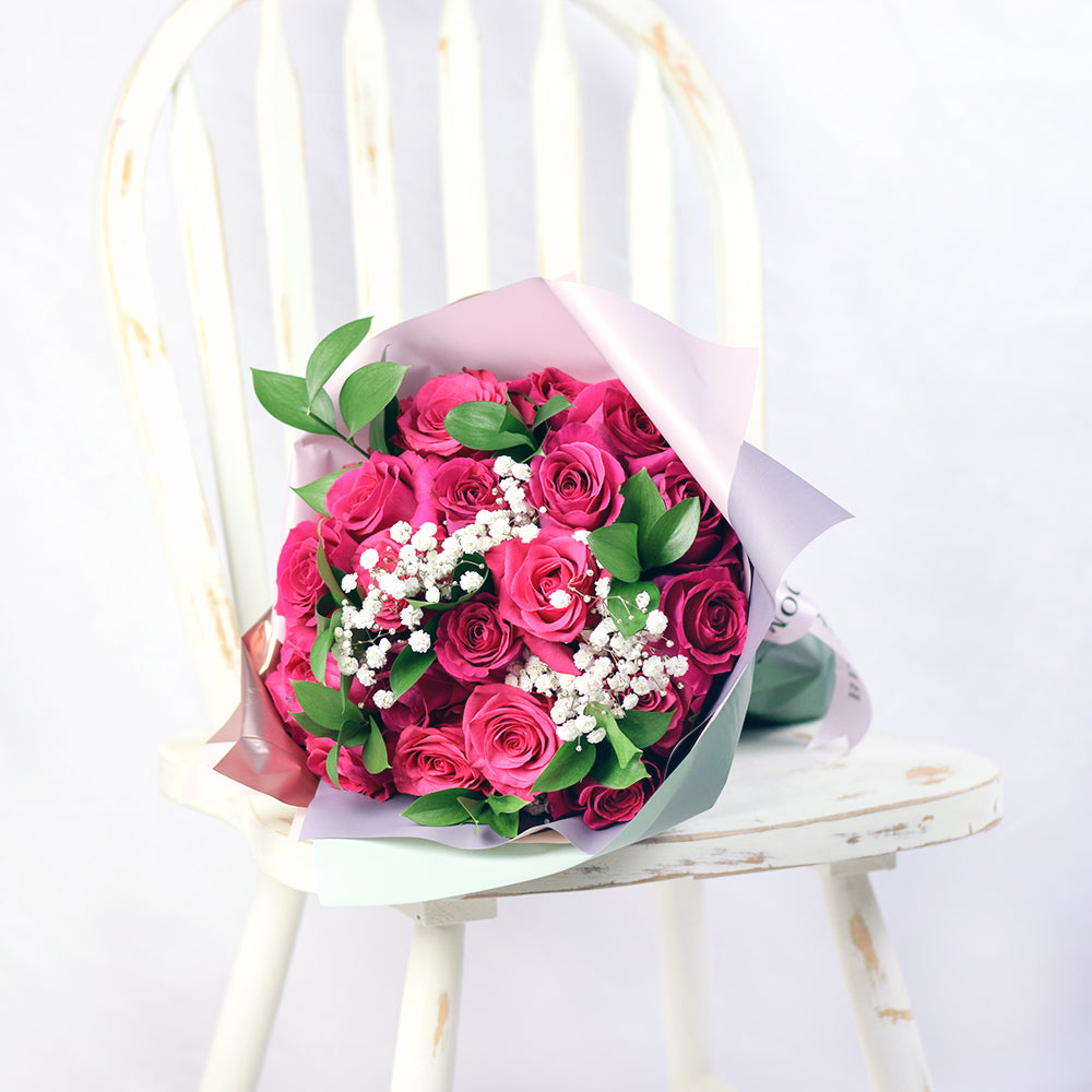 bouquet with pink roses, ruscus and baby's breath wrapped in floral wrap and designer ribbon, – Canada Blooms - Canada Delivery
