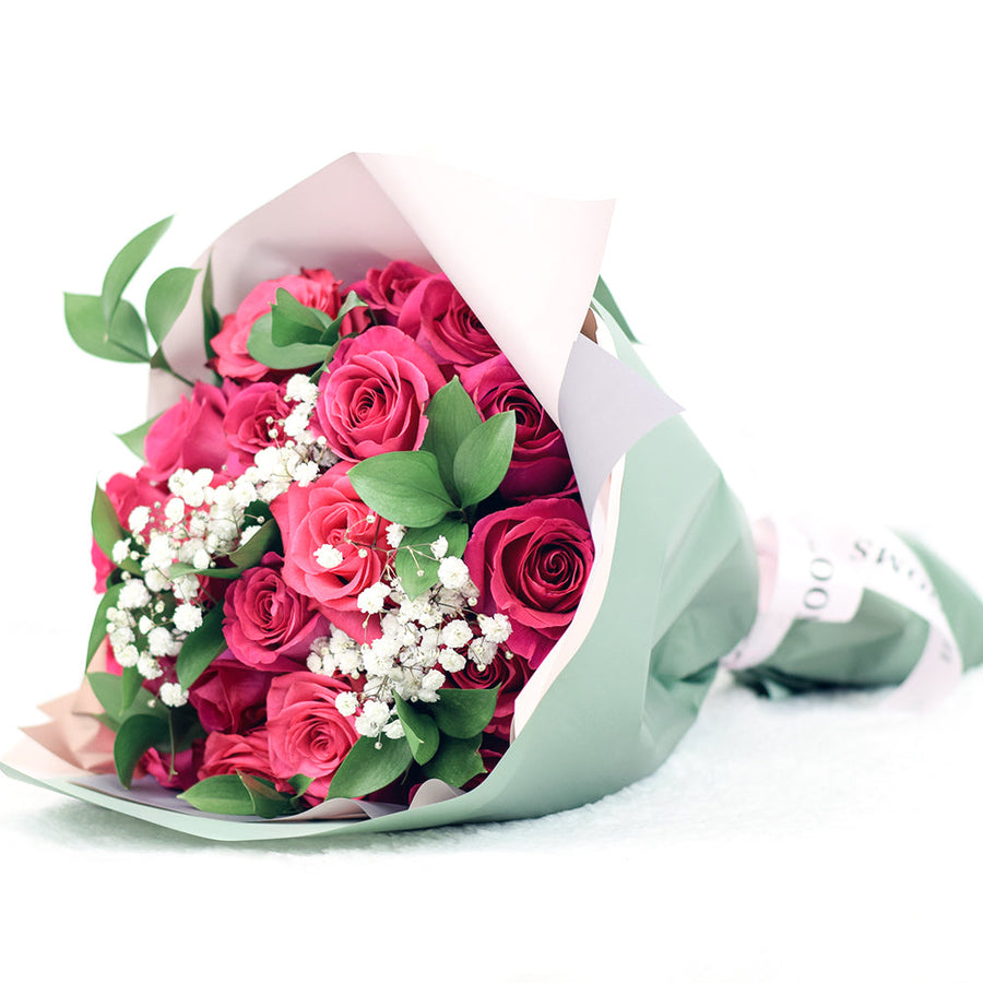 bouquet with pink roses, ruscus and baby's breath wrapped in floral wrap and designer ribbon, – Canada Blooms - Canada Delivery
