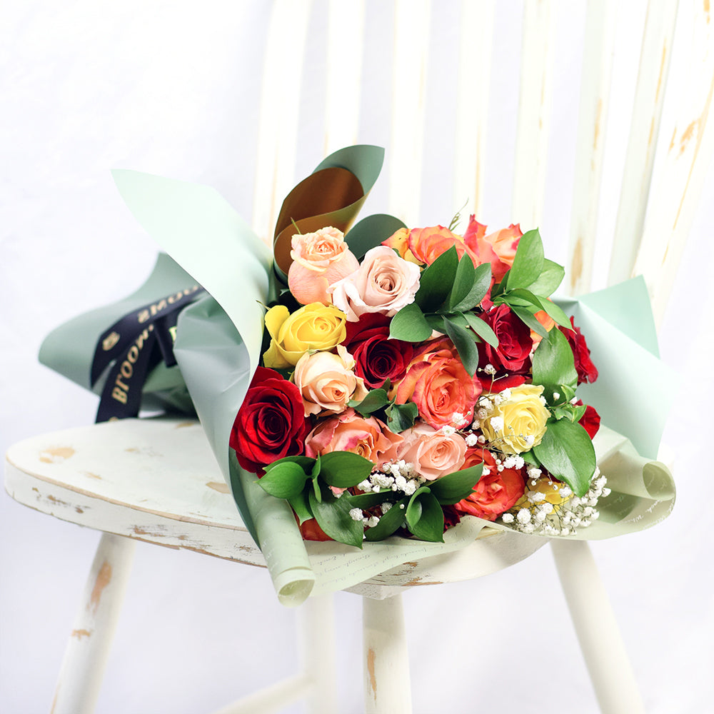 Bouquet with red, orange and yellow roses. Baby's breath and ruscus – Canada Blooms - Canada Delivery