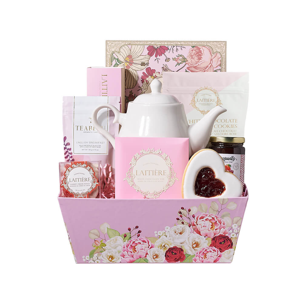 Sweet Treats &amp; Tea Gift Tray, English Breakfast tea, a classic teapot for brewing and serving, a selection of tea-inspired chocolate truffles, a white chocolate bar, assorted macarons, cherry cream ring candies, strawberry rhubarb preserves, white chocolate chip pink velvet cookies, a heart cookie filled with jelly, all presented in a pink floral market tray, Gourmet Gifts from Canada Blooms - Canada Delivery