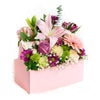 Pink and white mixed floral arrangement in a pink toolbox. Same Day Blooms Canada Delivery.