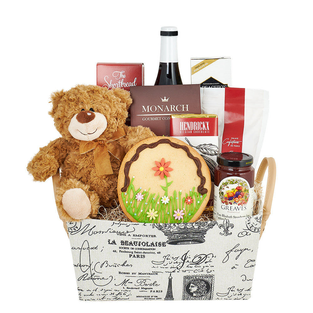 “With Love From Paris” Wine Gift Basket, hand-decorated sugar cookie, a bar of Belgian dark chocolate, cookies, crackers, Greaves' rhubarb strawberry jam, Monarch candies, gourmet hot chocolate, an adorable plush bear, and a customizable or upgraded bottle of wine from our extensive selection, Gourmet Gifts from Canda Blooms - Same Day Canada Delivery.